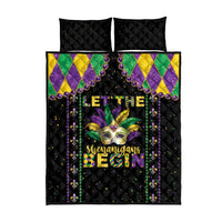Black quilt bed set with two matching pillow shams; Mardi Gras text and fleur-de-lis graphic