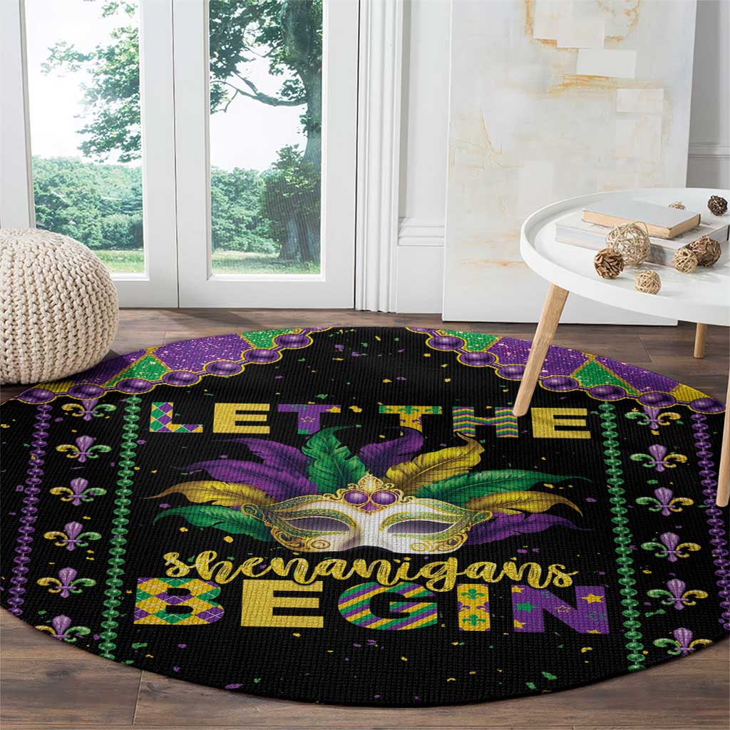 Round black Mardi Gras area rug with “Let the shenanigans begin” design