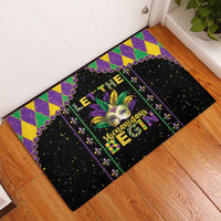 Black Mardi Gras rubber doormat with purple frame, fleur-de-lis mask, diamond pattern