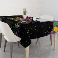 Black party tablecloth with purple and green fleur-de-lis and confetti print