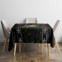 Black square tablecloth with colorful fleur-de-lis stripe and confetti speckles