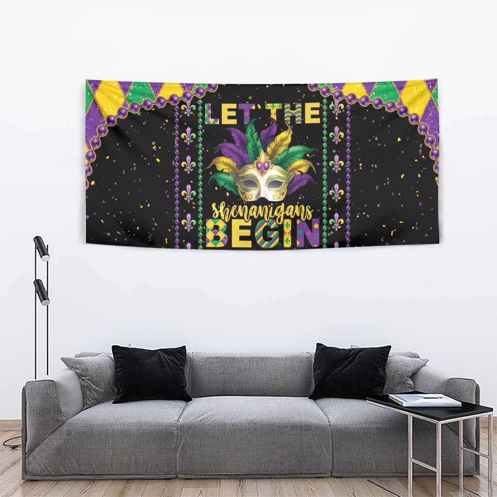 Black Mardi Gras wall tapestry with colorful mask, harlequin frame, and purple bead drips.