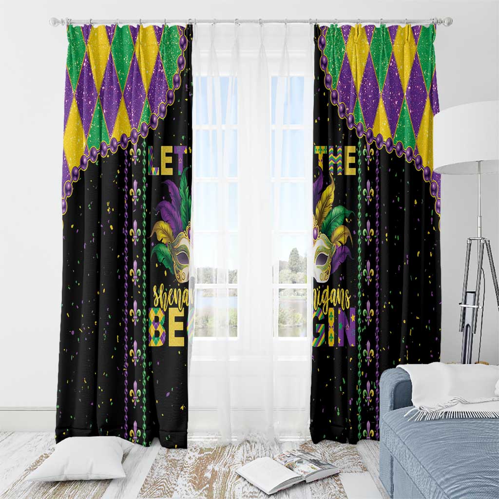 Black Mardi Gras window curtain pair with central masked face graphic and fleur-de-lis pattern