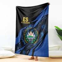 Black and blue El Salvador blanket with coat-of-arms triangle emblem, draped