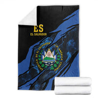 Folded black and blue El Salvador blanket with coat-of-arms triangle emblem, with rolls