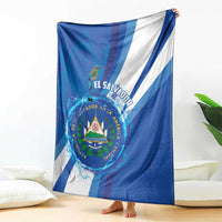 Blue and white striped blanket with center crest and bird emblem, draped on floor