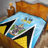 Light blue quilt blanket on bed with “7 58 L•VE” and Saint Lucia coat of arms graphic