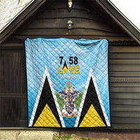 Light blue quilt blanket with diamond quilting and “7 58 L•VE” Saint Lucia crest center