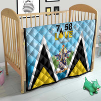 Light blue quilt blanket with diamond quilting, “7 58 L•VE” and Saint Lucia crest design