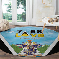 Blue round carpet featuring Saint Lucia crest and LOVE 58, black-and-white diagonal border