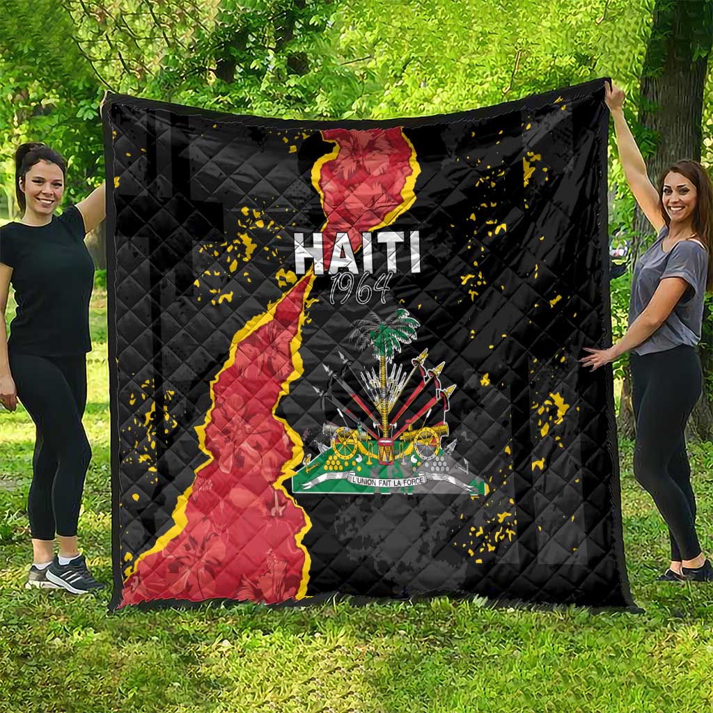 Black quilt blanket spread outdoors, showing Haiti map and colorful coat of arms