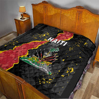 Black quilt blanket on bed with Haiti map and coat of arms graphic