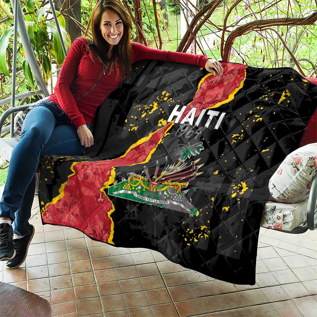Black quilt blanket held outdoors, Haiti map artwork with coat of arms and yellow specks