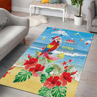 Blue rectangular Christmas area rug featuring a macaw parrot, red poinsettias, and holiday text