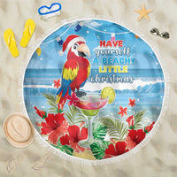 Round blue beach blanket with fringed edge, red macaw and tropical floral print