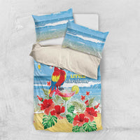 Blue tropical Christmas bedding set shown flat with duvet cover and two pillowcases