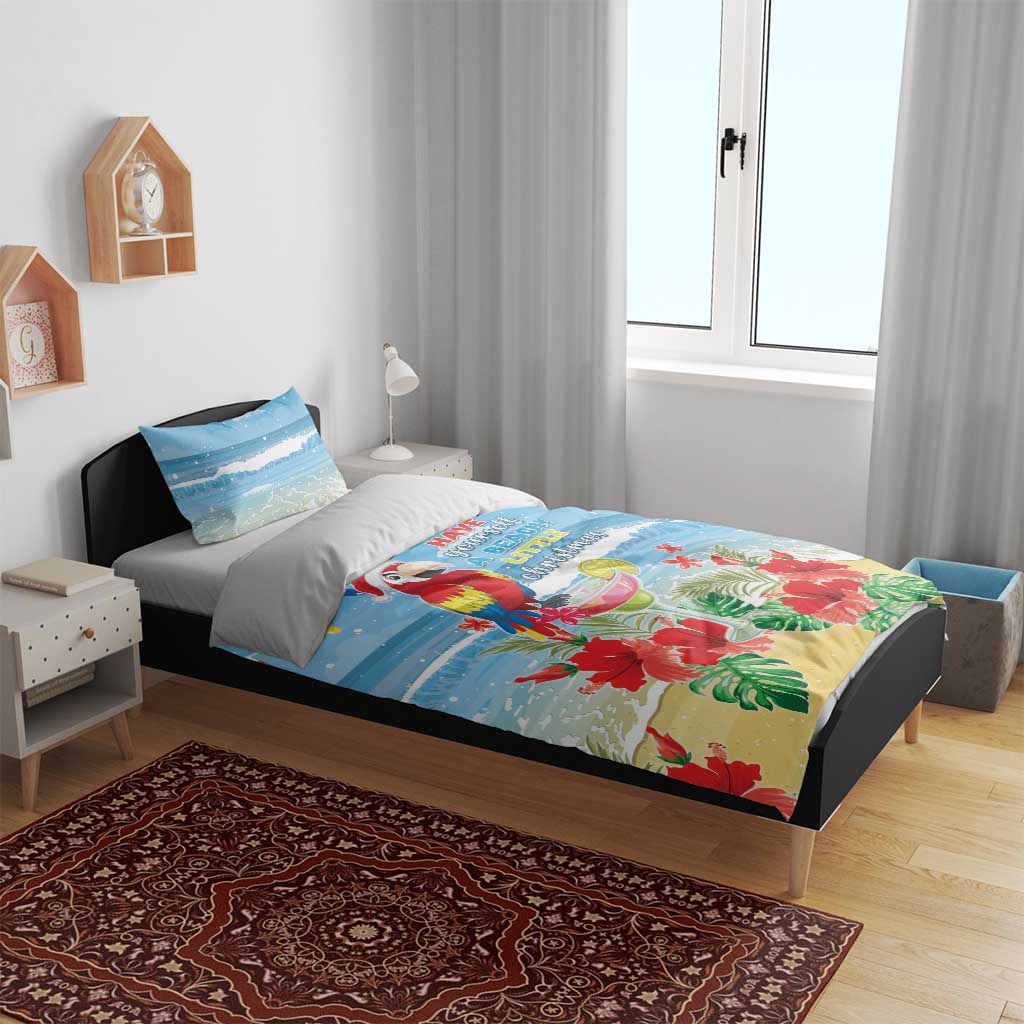 Blue tropical Christmas bedding set on a bed with parrot and floral print, two pillowcases