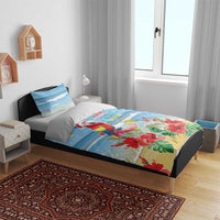 Blue tropical Christmas bedding set on a bed with parrot and floral print, two pillowcases