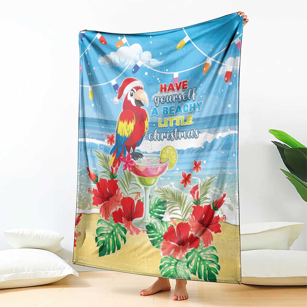 Blue tropical Christmas blanket draped with macaw, red hibiscus, and beachy quote