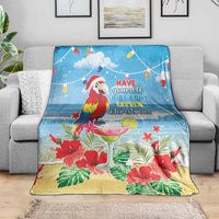 Blue tropical Christmas blanket with macaw, hibiscus flowers, and beachy quote