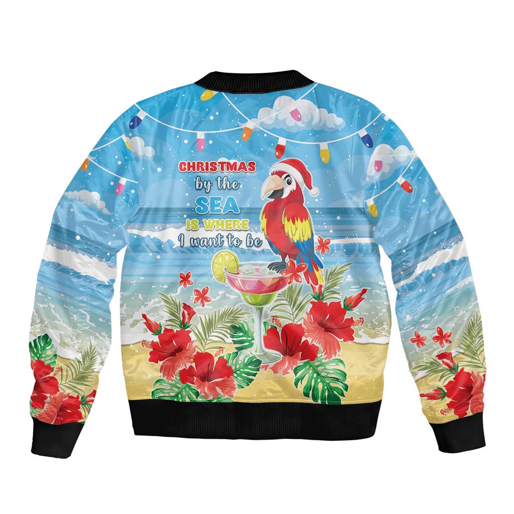 Blue bomber jacket back with tropical parrot, hibiscus flowers, Christmas beach text, black trim