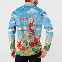 Blue button-up sweatshirt back on model with parrot, sea Christmas message, flowers