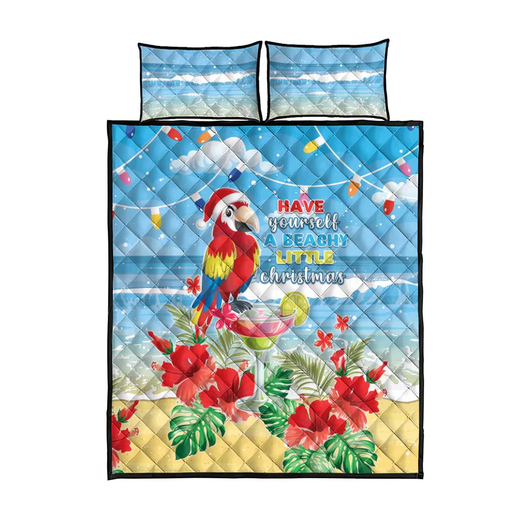 Blue quilt bed set with macaw and “Have yourself a beachy little Christmas”, plus 2 pillows