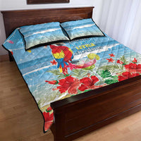 Blue tropical Christmas quilt bed set with macaw parrot, red flowers, and 2 pillows