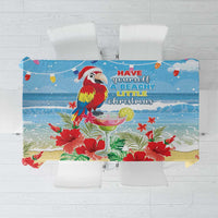 Blue tropical Christmas tablecloth with colorful macaw and poinsettias, lemons and text