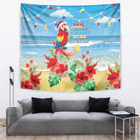 Blue tropical Christmas tapestry with colorful macaw parrot, beach, hibiscus flowers and lights