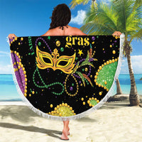 Round Mardi Gras beach blanket with gold carnival mask, glitter dots, and white tassel fringe