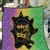 Mardi Gras quilt with purple and green panels and gold decorative mask graphic