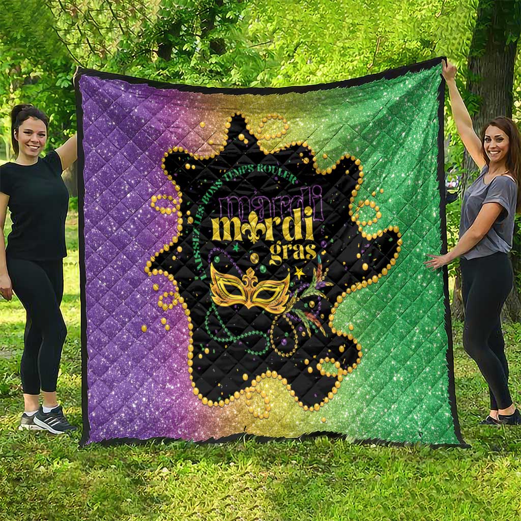 Large Mardi Gras quilt draped outdoors in purple and green with black mask centerpiece