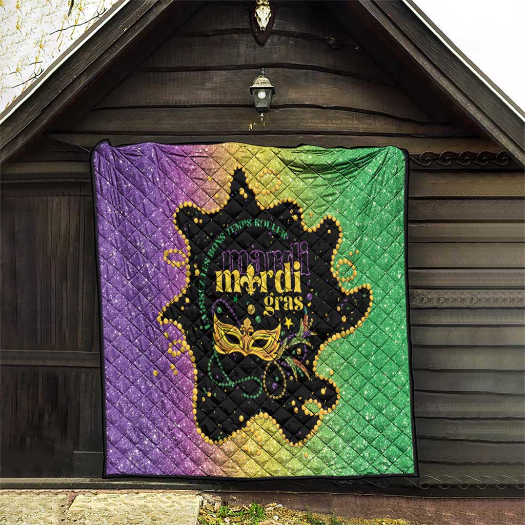 Mardi Gras quilt hanging on wall in purple and green with black mask and Mardi Gras text