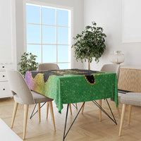 Rectangular Mardi Gras tablecloth with purple and green glitter pattern and gold decorative trim