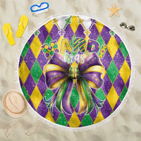 Round Mardi Gras beach blanket with glitter diamond pattern and large bow graphic
