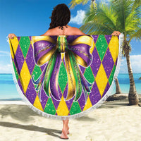 Round Mardi Gras beach blanket with glitter diamond pattern and large bow graphic, white fringe