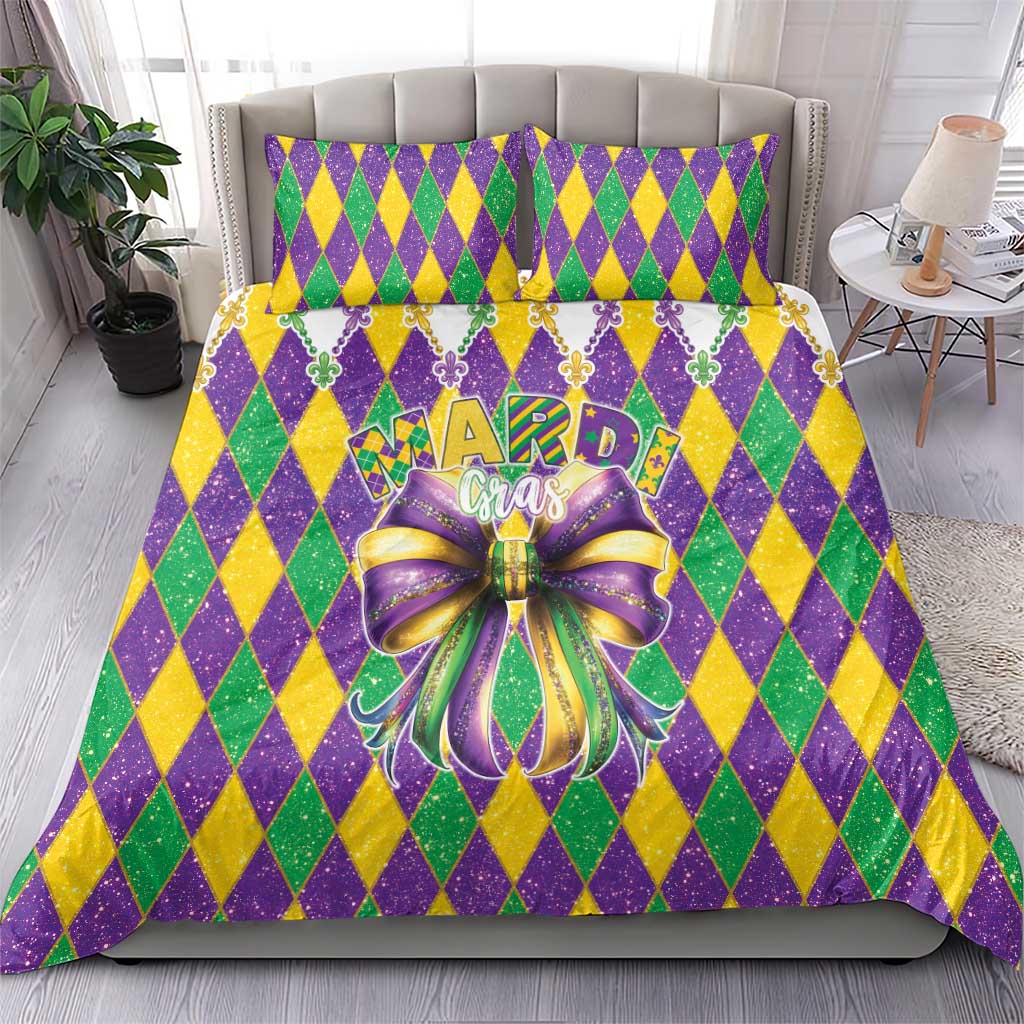Mardi Gras comforter and pillowcases in purple, green, yellow diamonds with fleur-de-lis trim and bow
