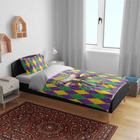 Mardi Gras bedding set on bed with purple, green, yellow diamond pattern and large bow