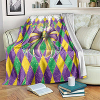 Mardi Gras themed glitter blanket with purple, green, yellow diamond pattern and bow