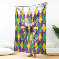 Mardi Gras bow blanket with purple, green, yellow diamond design and glitter trim