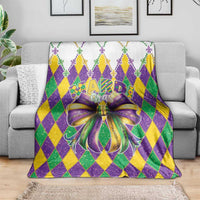 Mardi Gras diamond pattern blanket with large purple and gold bow graphic