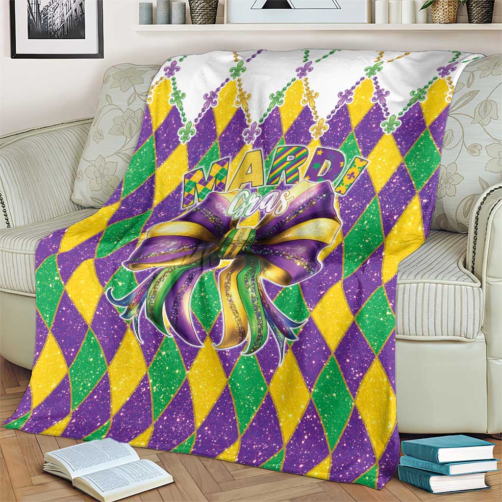 Colorful diamond Mardi Gras blanket with large purple bow and fleur-de-lis accents
