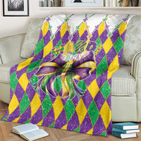 Colorful diamond Mardi Gras blanket with large purple bow and fleur-de-lis accents