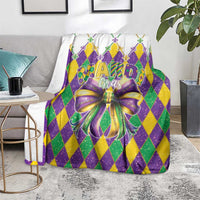 Mardi Gras blanket draped on couch, purple, green and yellow diamond design