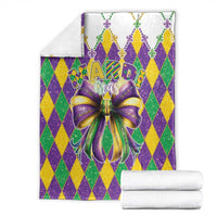 Mardi Gras themed blanket set with diamond pattern and large purple-gold bow graphic