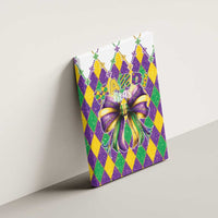 Mardi Gras canvas wall art tilted on wall, featuring bow and harlequin diamonds