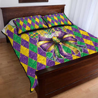 Mardi Gras quilt with purple, green, yellow diamond pattern and glittery bow motif