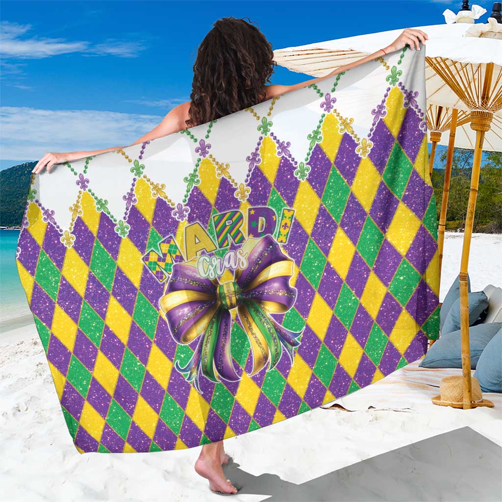 Mardi Gras sarong with green, purple, yellow diamond pattern, glitter 'Mardi Gras' text, bow