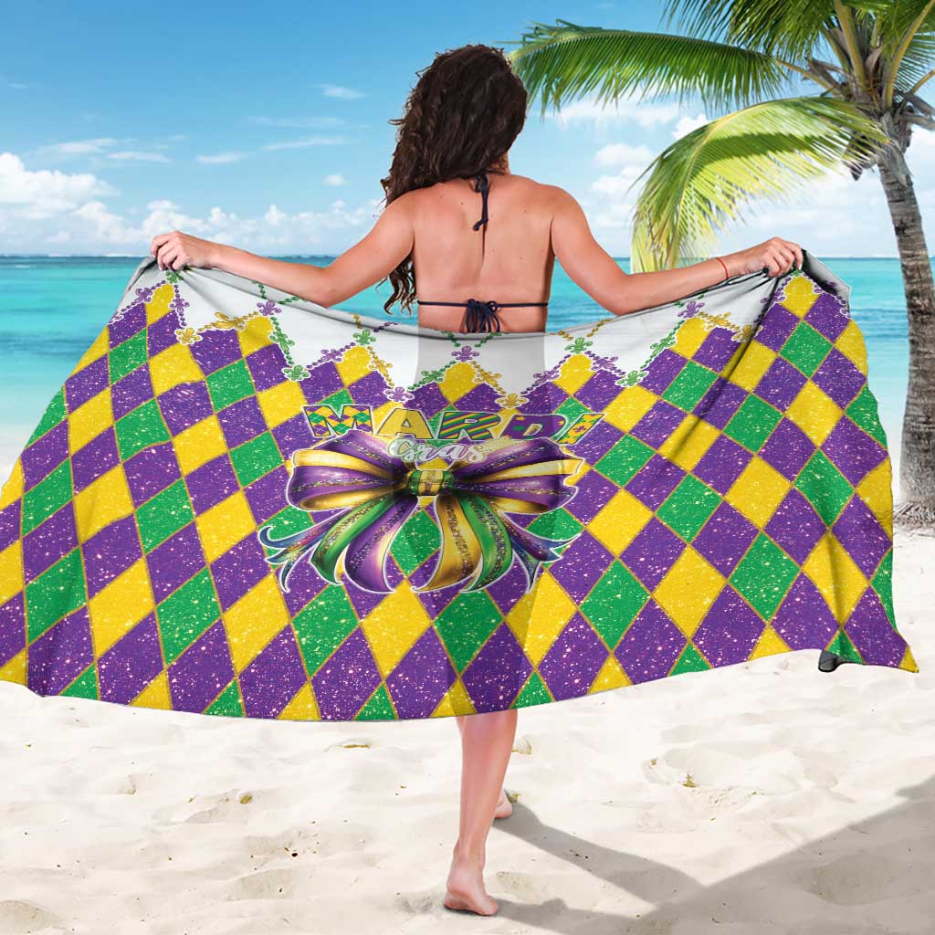 Colorful Mardi Gras sarong with purple, green, yellow diamond pattern and center bow